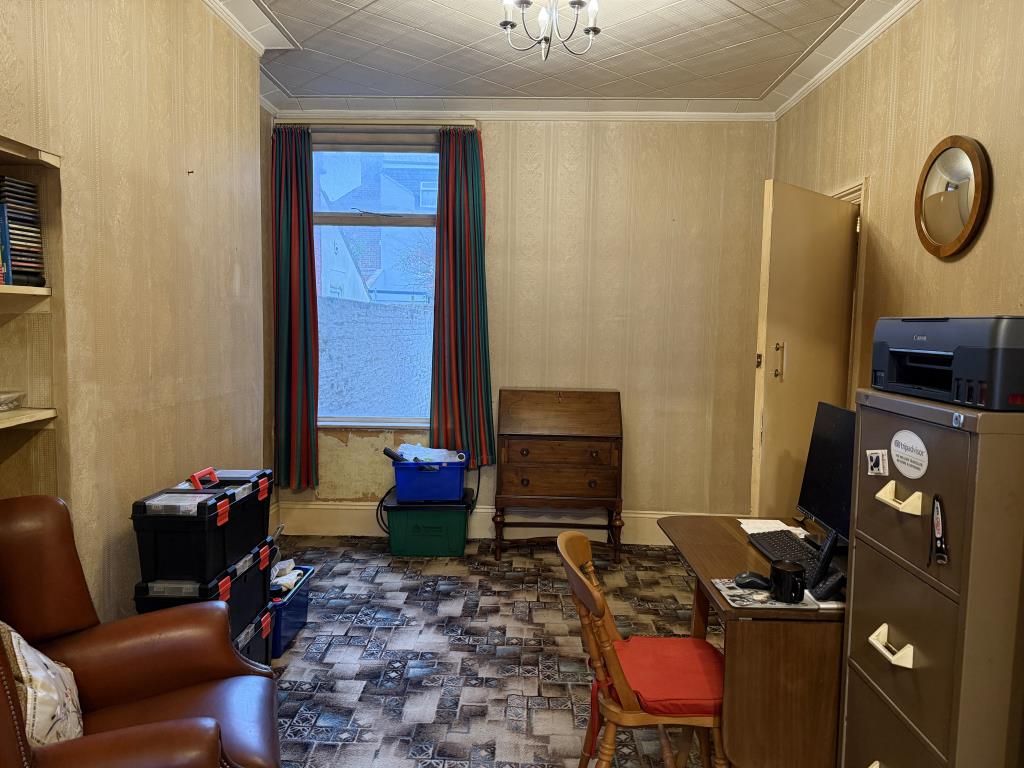 Lot: 147 - THREE-BEDROOM HOUSE IN NEED OF IMPROVEMENT - Living room with window to rear